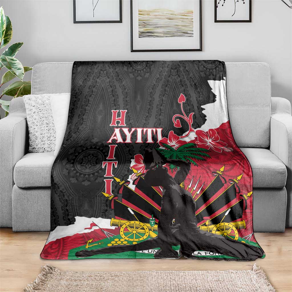 Black blanket with bold hibiscus and Polynesian geometric print, red and green accents