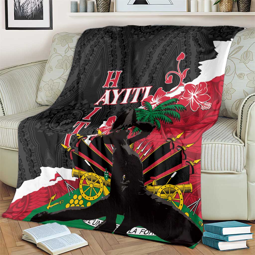 Black blanket spread on couch with large hibiscus flower and geometric burst design