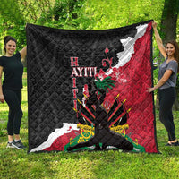 Quilted throw blanket spread outdoors, black and red Polynesian-style pattern with bold text