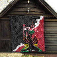 Quilted throw blanket hanging on porch, black and red pattern with floral and geometric motifs