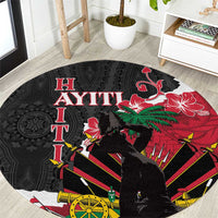 Black round carpet with bold red and green Polynesian dashiki pattern and crown motif