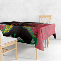 Corner view of black and red polynesian tablecloth with leafy and geometric motifs