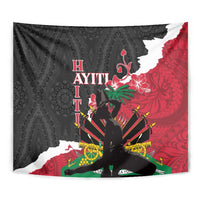 Black, red, and white tapestry close view with ornate pattern and central seated figure