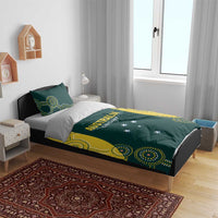 Australia cricket bedding set on bed with dark green comforter, yellow patterns, and star details.
