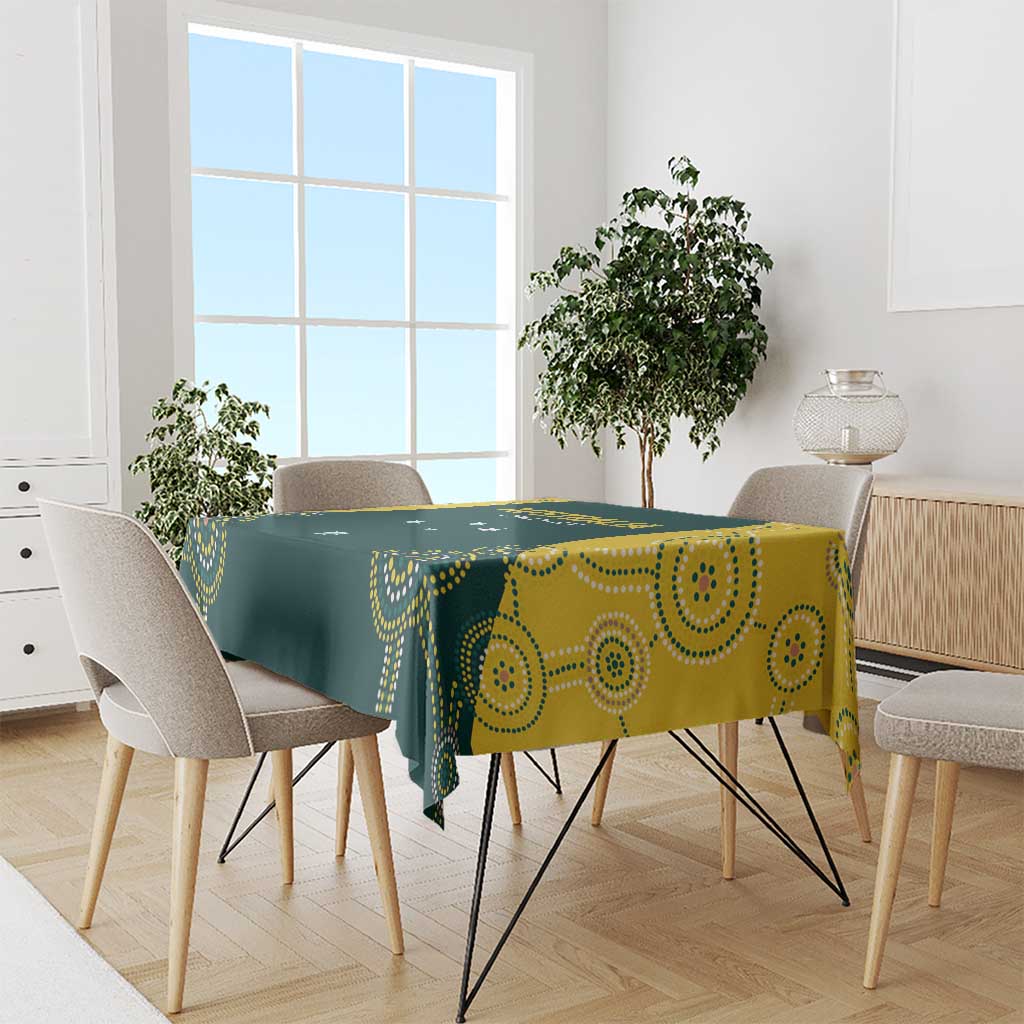 Cricket tablecloth draped on dining table, dark green with yellow dotted swirl pattern