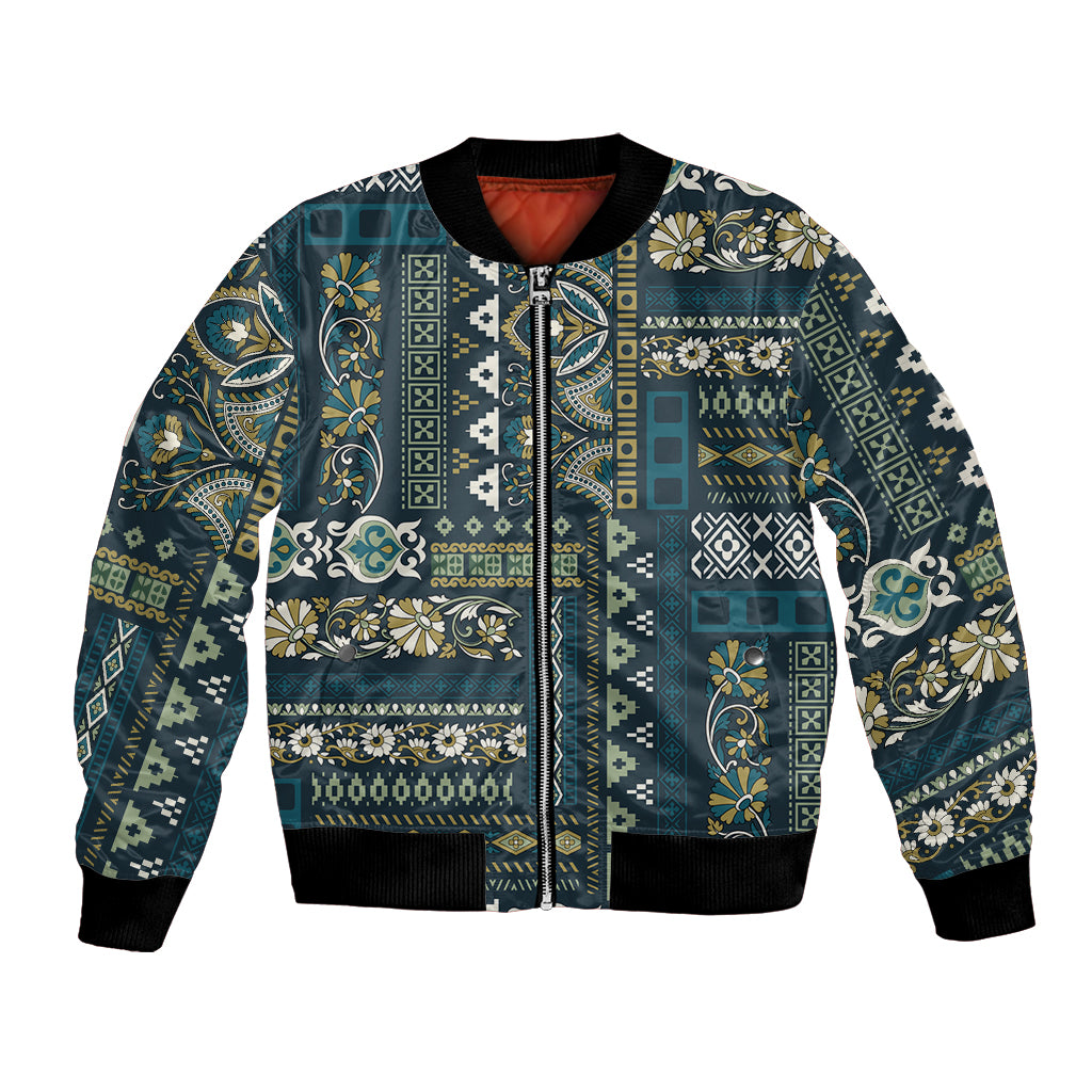 Blue patchwork bomber jacket with full front zip, ribbed cuffs, and multicolor ornate pattern