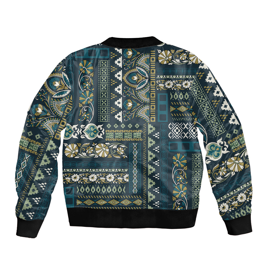 Blue patchwork bomber jacket with ribbed hem and cuffs, multicolor ornate geometric pattern
