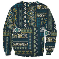 Unisex crewneck sweatshirt with blue patchwork medallion, paisley, and stripe panels