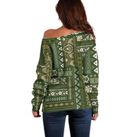 Women’s off-shoulder sweater in green with ornate patchwork pattern, long sleeves