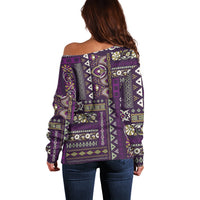 Purple off-shoulder sweater with long sleeves and ornate patchwork print, back view