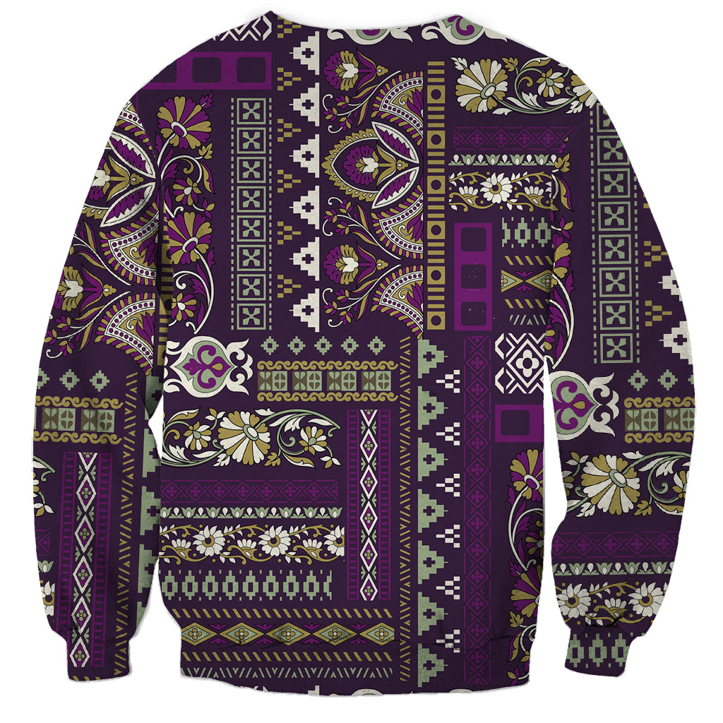 Purple crewneck sweatshirt with vibrant patchwork panel design, long sleeves