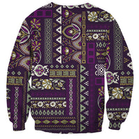 Purple crewneck sweatshirt with vibrant patchwork panel design, long sleeves