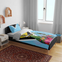 Sky blue duvet cover set with parrot and flower print, yellow crest, and black-and-white stripe blocks