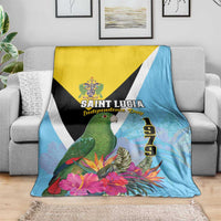 Tropical blanket on sofa: sky blue with yellow panel, black triangle, parrot and flowers