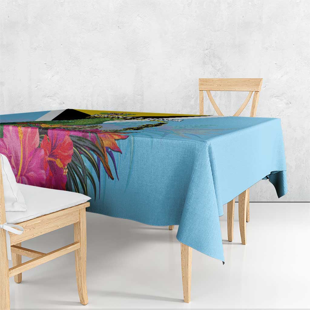 Sky blue tablecloth corner detail with tropical leaves and flowers print