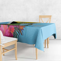 Sky blue tablecloth corner detail with tropical leaves and flowers print