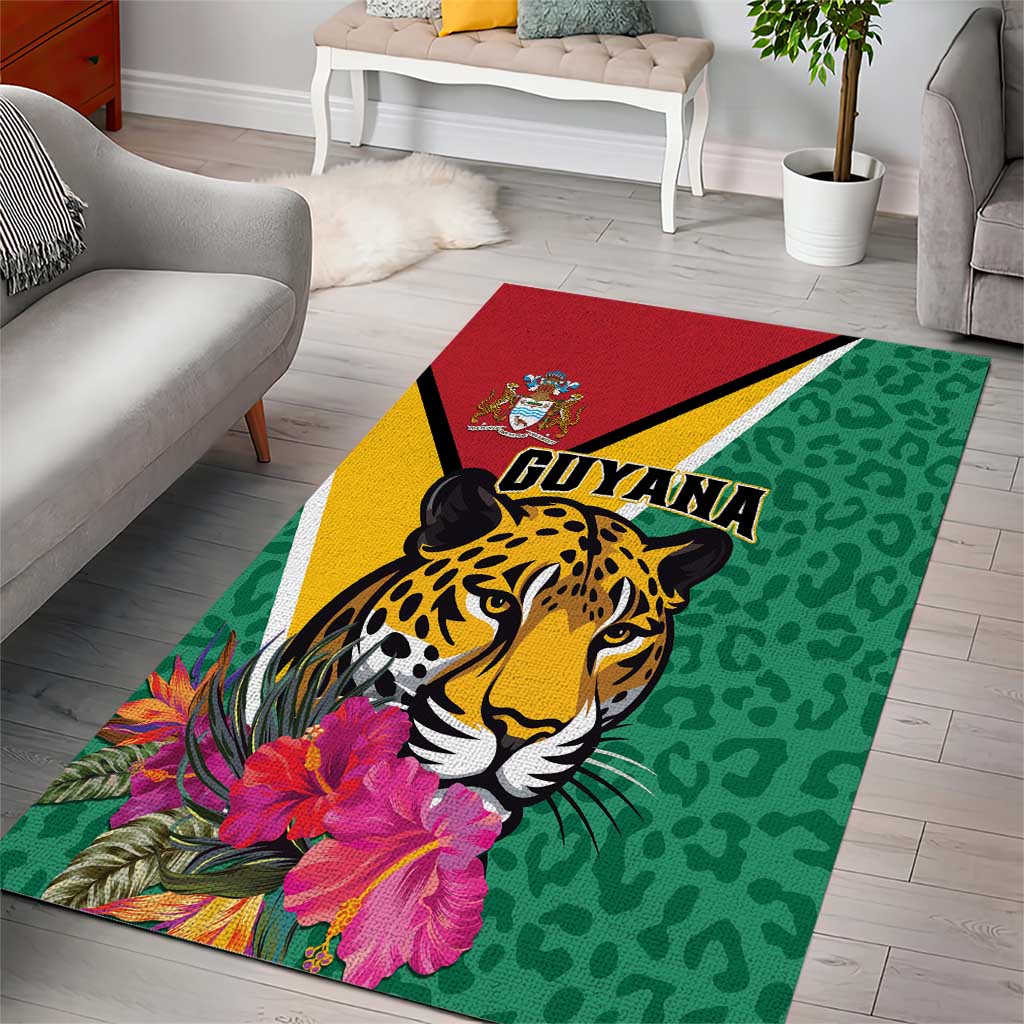 Green area rug with jaguar face, tropical flowers, yellow and red border, GUYANA text