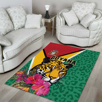 Green area rug with jaguar head artwork, tropical flowers, and GUYANA logo on center
