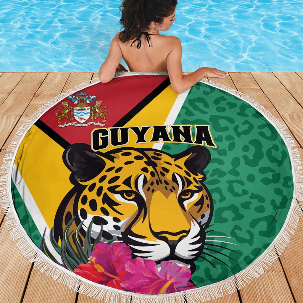Round green beach blanket with jaguar portrait, tropical flowers, and white fringed border