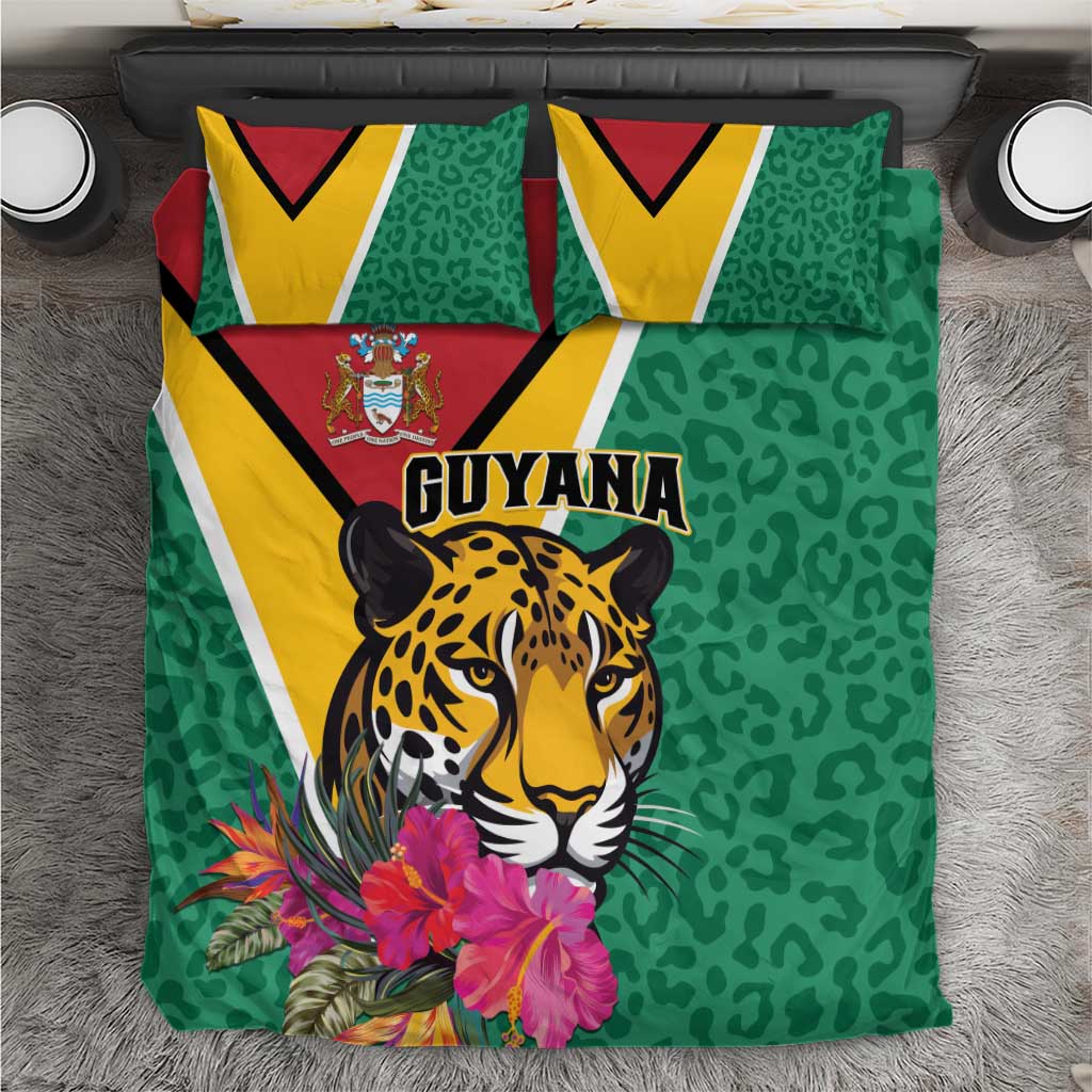 Green bedding set with jaguar face, tropical flowers, and Guyana text on duvet & pillows