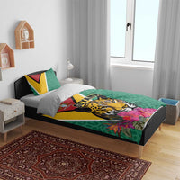 Green bedding set on bed: jaguar graphic and flowers with Guyana text on duvet