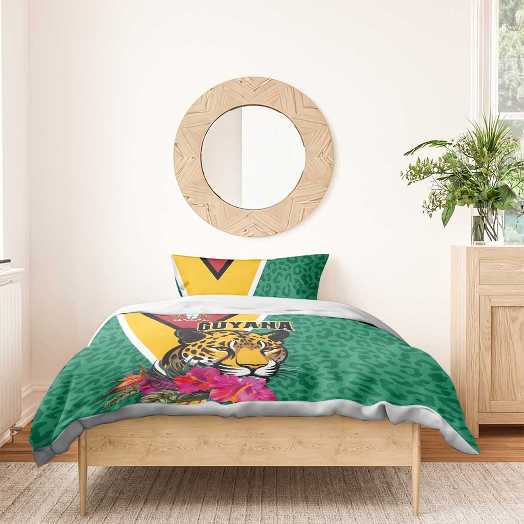 Green bedding set on wooden bed: jaguar face and flowers with Guyana text on duvet