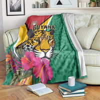 Green jaguar throw blanket with GUYANA text and tropical pink flowers