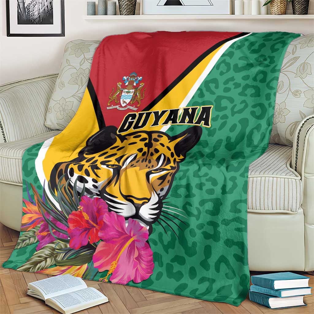 Green Guyana jaguar throw blanket draped over armchair, pink flowers