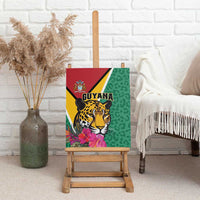 Green canvas wall art of a jaguar and pink tropical flowers on a canvas mounted on a wooden easel