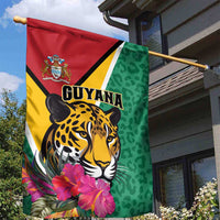 Green garden flag with jaguar illustration, Guyana text, and pink tropical flowers