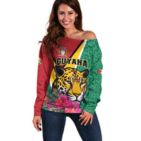 Off-shoulder sweater in maroon and green with jaguar face and floral print