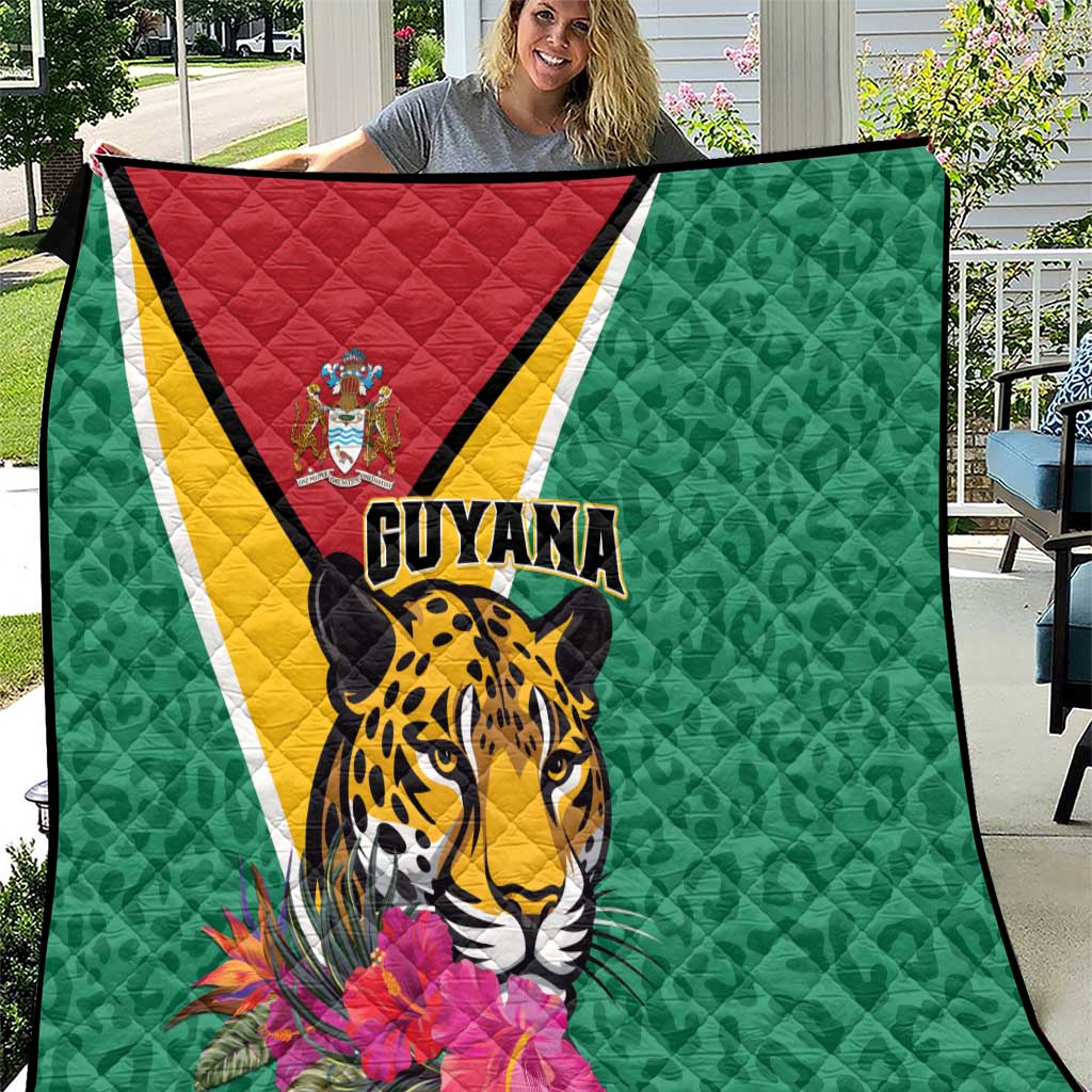 Green Guyana quilt with jaguar face, tropical flowers, and red-yellow diagonal stripe