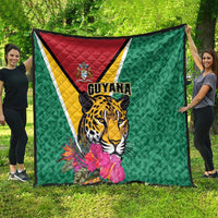 Green Guyana quilt featuring full jaguar artwork, tropical flowers, and diagonal flag stripe