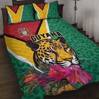 Green quilt bed set with jaguar graphic, Guyana lettering, tropical flowers, and matching pillows