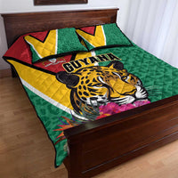 Green quilt bed set with jaguar head and Guyana text, framed by yellow and red stripes