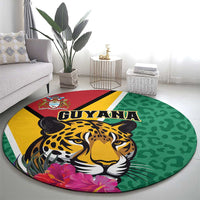 Round green circular rug featuring jaguar portrait with GUYANA text and tropical flower print.
