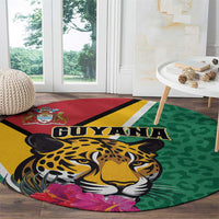 Round green circular rug with jaguar head, GUYANA text, and red-yellow stripe border.