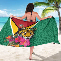 Green sarong with jaguar and flowers, central Guyana graphic and multicolor trim