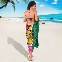 Green sarong tied at the back, jaguar head and pink flower print panel