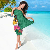 Green sarong with jaguar and tropical flower print, multicolor diagonal edge