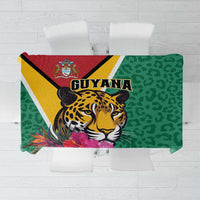 Green tablecloth with jaguar and tropical flower graphic, leopard pattern