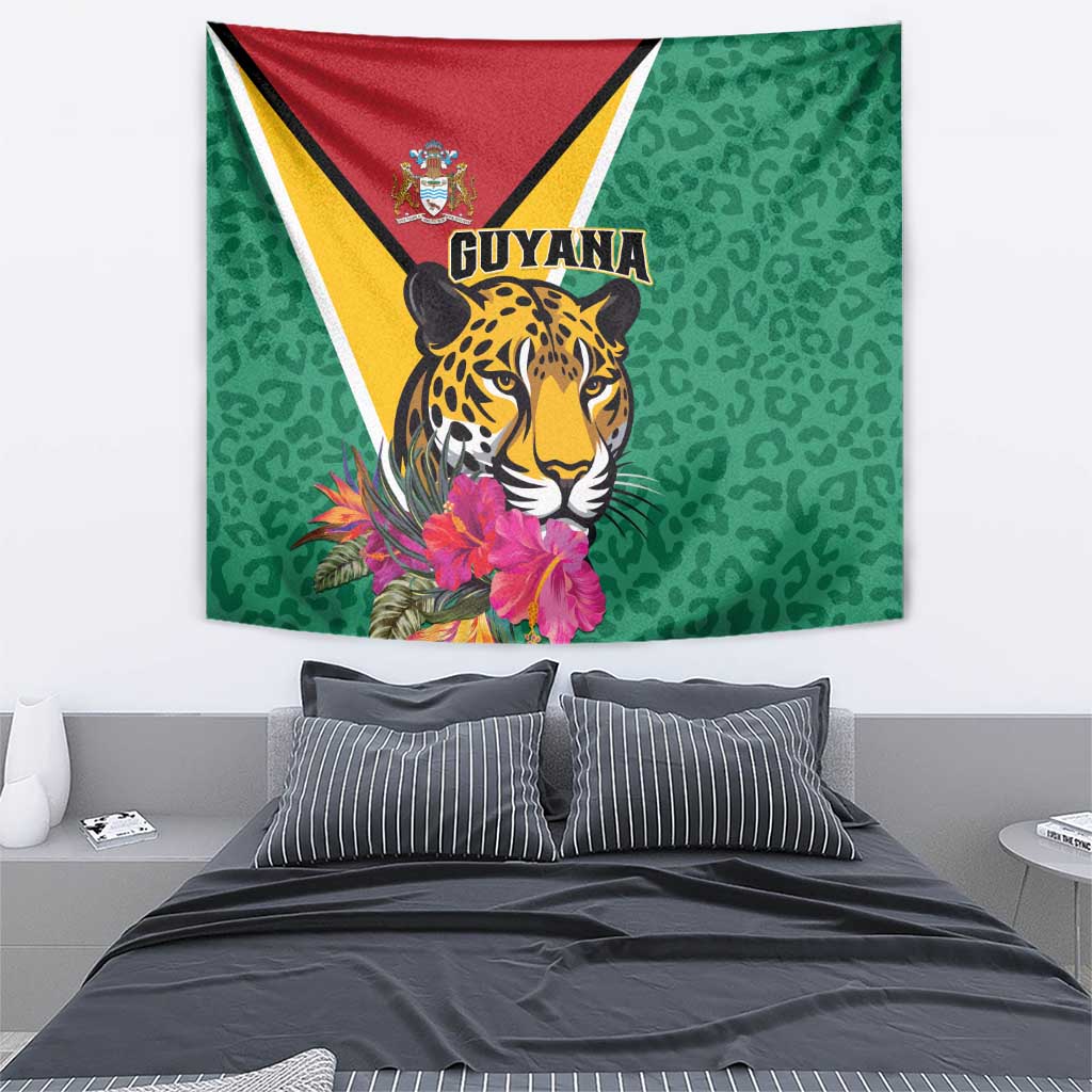 Green wall tapestry with jaguar and Guyana crest, pink tropical flowers, leopard pattern