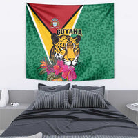 Green wall tapestry with jaguar and Guyana crest, pink tropical flowers, leopard pattern