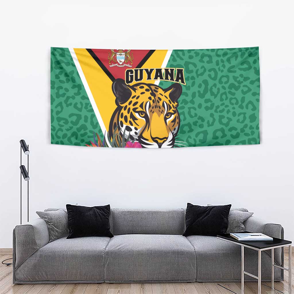 Green tapestry with jaguar face artwork and pink tropical flowers