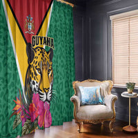 Green tropical window curtain with Guyana jaguar head, crest, and pink flower print