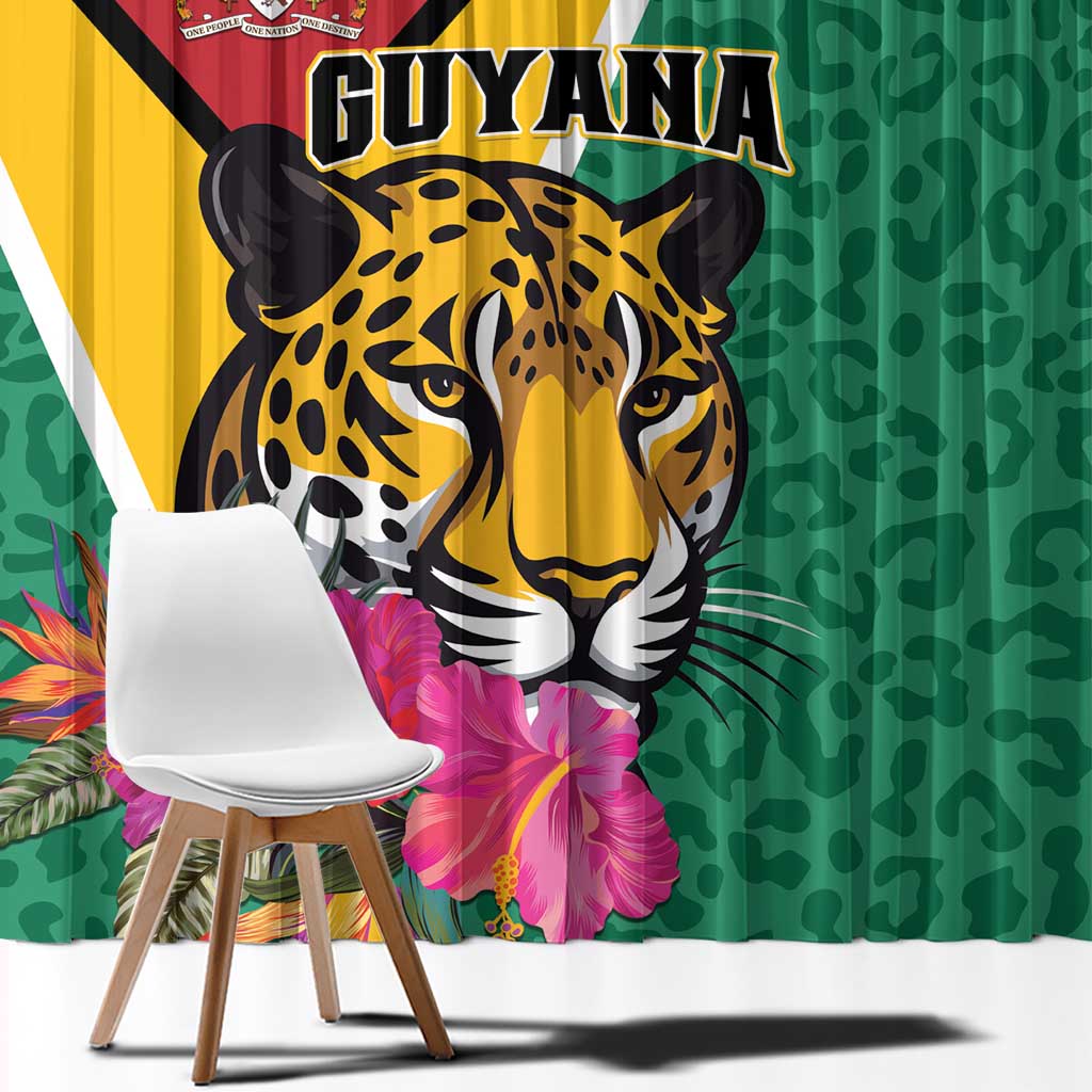 Green curtain panel with large Guyana jaguar face, bold stripes, and pink tropical blooms
