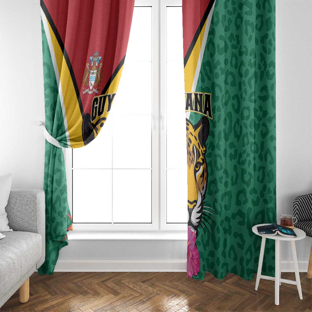 Green window curtain panels with Guyana jaguar and red-gold stripe accent, hanging at door