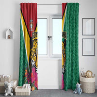 Green hanging window curtains with Guyana jaguar, crest, and pink hibiscus flowers