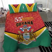 Flag-style bedding set on bed: red duvet with crest emblem, green sides, two pillows