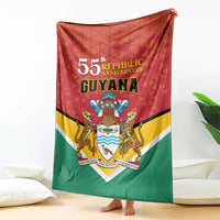 Guyana anniversary blanket with 55th text, crest shield emblem, and red-yellow-green flag